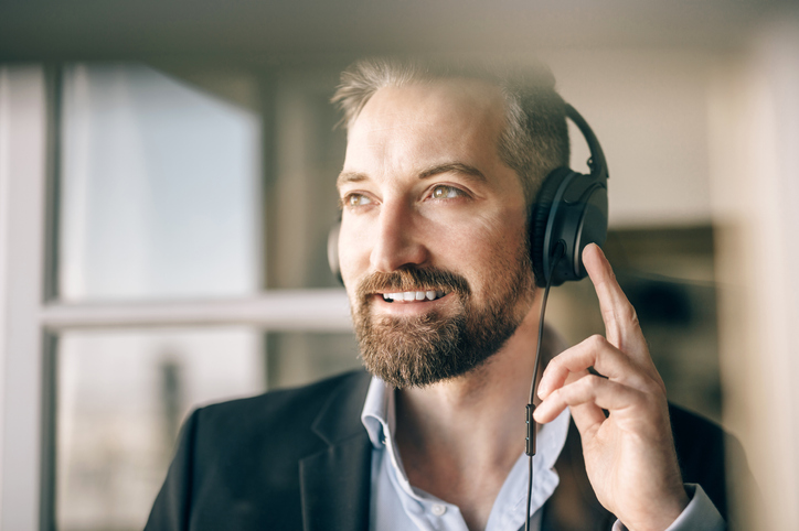 man listening to podcast